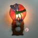 Dragonfly Stained Glass Night Light- in green and blue iridescent glass with yellow, orange mottle glass backdrop. Shown lite.