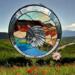 Native Spirit 20 inch round panel, made with a beveled Native American bodice in the center, browns, greens, blues create a desert oasis surrounding him and a beveled outer rim encases the scene.