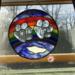 10" Rainbow Bridge beveled paw print stained glass panel. Shown in a window for size reference.