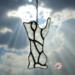 Ornaments by Robin C. Hary- gray- shown hanging on a Christmas tree.