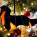 Dachshund Longhaired stained glass ornament- shown hanging from a Christmas tree.