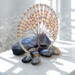 Boho tree of life wall art with wooden beads and wire in a rustic round hoop.