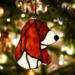 Basset Hound stained glass ornament in Red and White- shown hanging on a Christmas Tree.