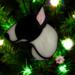 Bull Terrier stained glass ornament- shown in Black and White hanging on a Christmas tree.