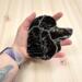 Large Poodle stained glass ornament- in Black- shown being held for size reference. Approx. 5.5" wide by 5" tall.