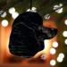 Large Poodle stained glass ornament- in Black- hanging on a Christmas tree.