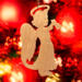 A handmade wooden Christmas ornament in the shape of a cheerful angel, featuring a halo, wings, and a raised arm ringing a bell, hand-cut from solid hardwood and finished with clear shellac.