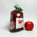 Irish Twins Apple Cinnamon Potpourri bag with a green bow and a single red apple on a white background.