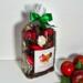 Irish Twins Apple Cinnamon Potpourri bag with apples and green leaves against a white wood-panel background.