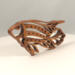 Handcrafted wooden tropical fish ornament made from 1/4-inch thick oak, finished with shellac, designed for holiday decor or year-round display as wall art.