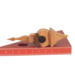 Handcrafted miniature wooden birdhouse ornament shaped like an icecicle with a pointed roof and base, featuring a rounded entrance hole and a perched bird, and made from reclaimed hardwoods finished with a satin shellac.