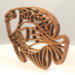 Handcrafted wooden tropical fish ornament made from 1/4-inch thick oak, finished with shellac, designed for holiday decor or year-round display as wall art.