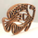 Handcrafted wooden tropical fish ornament made from 1/4-inch thick oak, finished with shellac, designed for holiday decor or year-round display as wall art.