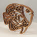 Handcrafted wooden tropical fish ornament made from 1/4-inch thick oak, finished with shellac, designed for holiday decor or year-round display as wall art.