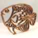 Handcrafted wooden tropical fish ornament made from 1/4-inch thick oak, finished with shellac, designed for holiday decor or year-round display as wall art.