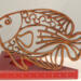 Handcrafted wooden tropical fish ornament made from 1/4-inch thick oak, finished with shellac, designed for holiday decor or year-round display as wall art.