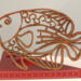Handcrafted wooden tropical fish ornament made from 1/4-inch thick oak, finished with shellac, designed for holiday decor or year-round display as wall art.