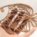 Handcrafted wooden tropical fish ornament made from 1/4-inch thick oak, finished with shellac, designed for holiday decor or year-round display as wall art.