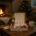 Handmade Dear Santa Letter Kit on table by fireplace & cocoa — cozy family holiday tradition crafted with love. Handmade Dear Santa Letter Kit on table by fireplace & cocoa — cozy family holiday tradition crafted with love.