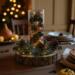 Handmade autumn centerpiece featuring pinecones, gold and bronze ornaments, and greenery; perfect for Thanksgiving tables.
 Handmade autumn centerpiece featuring pinecones, gold and bronze ornaments, and greenery; perfect for Thanksgiving tables.
