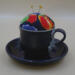 Looking at the front of the pincushion/bobbin holder, it's easy to see the lace on the mug and the colors of the flower of the pincushion. Looking at the front of the pincushion/bobbin holder, it's easy to see the lace on the mug and the colors of the flower of the pincushion.