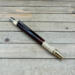 Dark wood and brass click pen  Dark wood and brass click pen