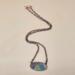 Handmade 16-inch copper necklace with flame-colored oval copper pendant in iridescent rainbow hues, hook clasp and copper chain. Handmade 16-inch copper necklace with flame-colored oval copper pendant in iridescent rainbow hues, hook clasp and copper chain.