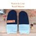 Pair of warm and cozy wool navy blue baby mittens with knit light blue ribbed cuffs; thumbless winter mittens for babies and toddlers.