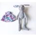 Handmade gray wool rabbit doll beside her removable floral cotton dress — eco-friendly heirloom toy.