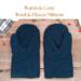 Pair of warm and cozy navy blue wool men's mittens on rustic wood background — winter extra large mittens for men.