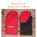 Pair of warm and cozy red and black wool men's mittens on rustic wood background — winter regular sized mittens for men.