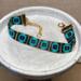  handcrafted loom-beaded bracelet with black , turquoise and gold beads 