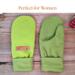Pair of green fleece regular sized mittens; soft fleece lined winter gloves for women.