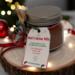 Hot Cocoa Jar surrounded by warm lights and ornaments, cozy handmade Christmas drink mix for gifting.