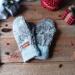 A cozy pair of teen, small woman’s handmade mittens crafted from fluffy gray fleece with silver gray ribbed cuffs; handmade and winter ready