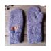 A cozy pair of teen, small woman’s handmade mittens crafted from an upcycled purple sweater with ribbed cuffs; handmade & winter ready.