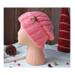 A hand knit wool beanie in solid pink features a stretchy, ribbed stitch pattern. Ideal for adults and teens, made from soft Turkish yarn.