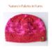 A hand knit red acrylic beanie in a textured stitch pattern. For winter holiday gifting for kids ages 6, 7, 8, 9.
