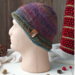 A hand knit acrylic & wool beanie in ombre red & blue. A winter holiday gift for children and preteens ages 10, 11, 12, 13, 14.