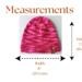 A babies & toddlers sized pink and red hat knit with acrylic. Perfect for winter a gift for a baby or toddler ages 1, 2, 3, 4, 5 years old.