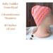 A handmade baby hat in a pink & yellow wool & acrylic yarn. Great for winter holiday gifting for newborn babies 0 to 12 months.