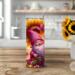 Lifestyle kitchen — Gnome & sunflower 20-oz stainless tumbler on kitchen table near sunflower vase; metal straw. By Tammi Oribello Designs