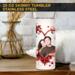Red heart photo tumbler on bedside table in cozy home scene