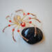 gold and red beaded spider ornament with faceted crystal body, metallic gold wire legs, and fiery glass bead accents 