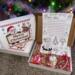 Dear Santa Letter Kit displayed open with letter sheet, candy cane, reindeer cocoa cone, and Christmas gift box under holiday lights