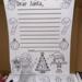 Close-up of Dear Santa letter sheet with Christmas illustrations inside the handmade letter kit box
