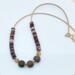 Handmade 17–18 inch necklace with Bronzite, Agate, and Mookaite beads, gold stainless steel accents, and a handmade hook clasp.