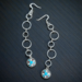 Very pretty pair of dangle earrings. they are western with a concho char,