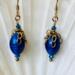 Earrings, sapphire blue oval beads and cascading 14 K gold filled chain, and Swarovski faceted bead accents