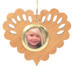 Wooden heart-shaped ornament with scalloped edges and an oak grain finish, featuring a removable round gold frame that holds a photo of a smiling blonde child.